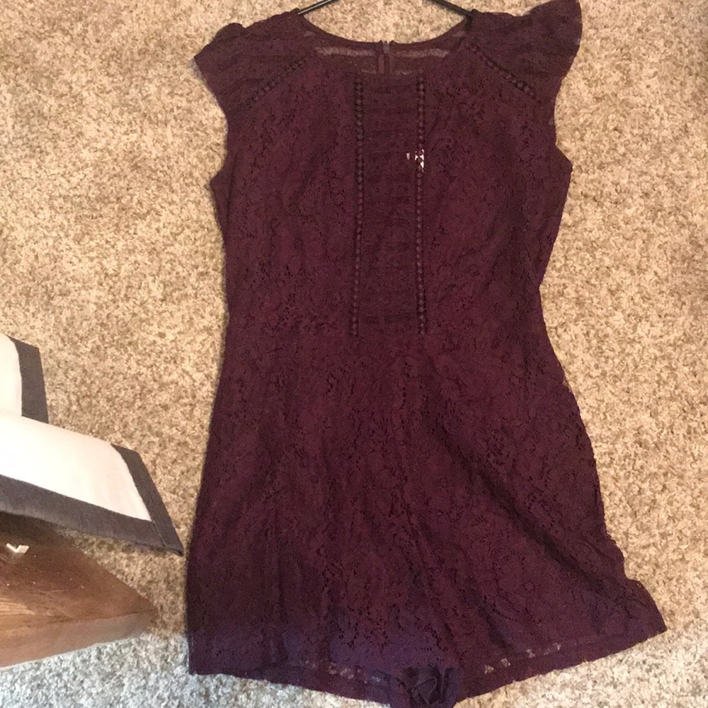 Lace plum romper. Sheer detail in front